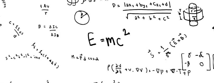 Numerous math equations written on a whiteboard.
