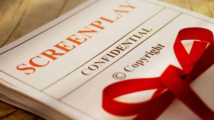 A hard copy of a screenplay wrapped in a red ribbon. 