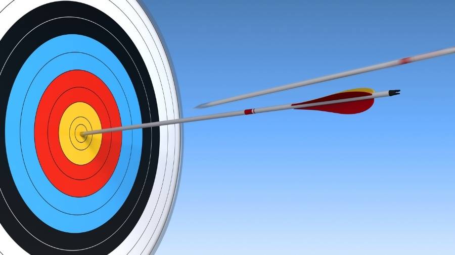 An archery target with an arrow in the bullseye. 